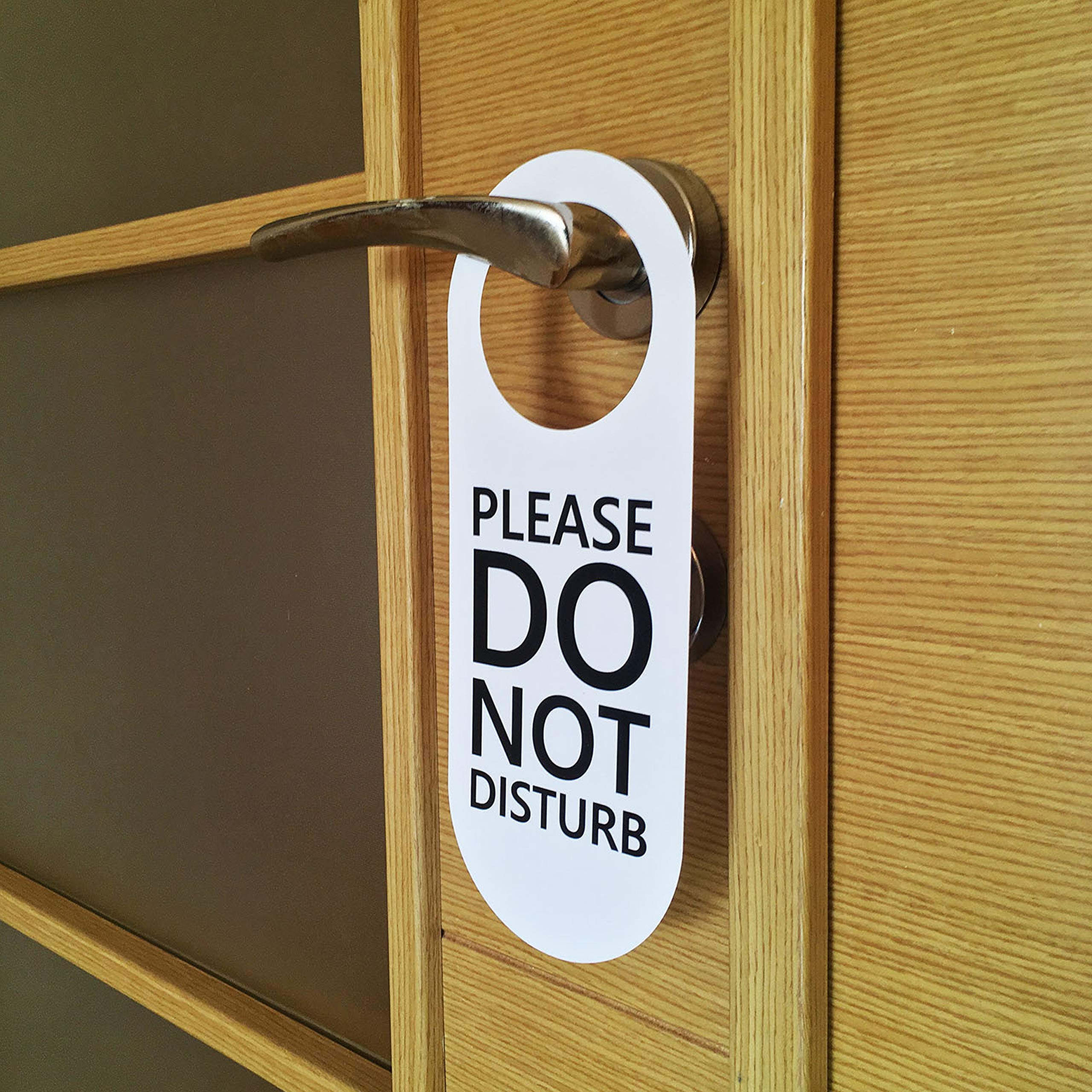 A closed door with a do not disturb sign.