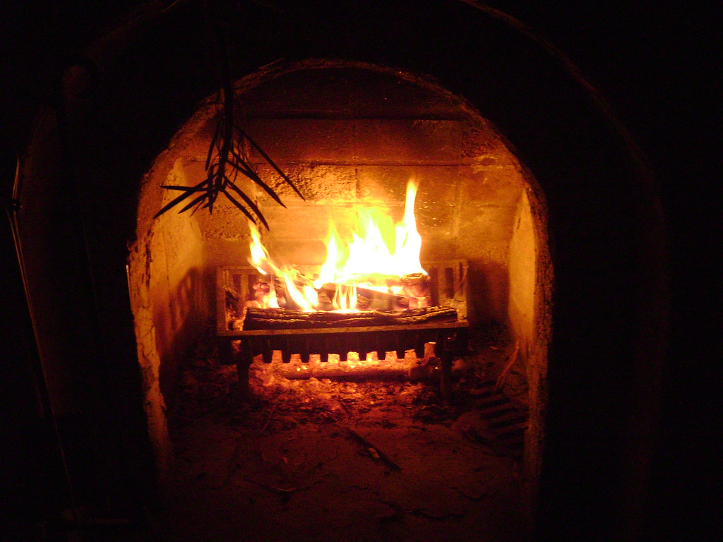 A cozy fireplace with festive decorations