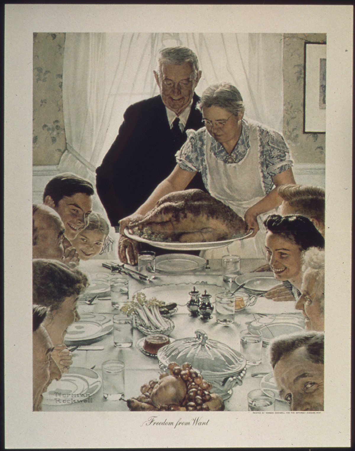 A family sitting around a dinner table, expressing gratitude.