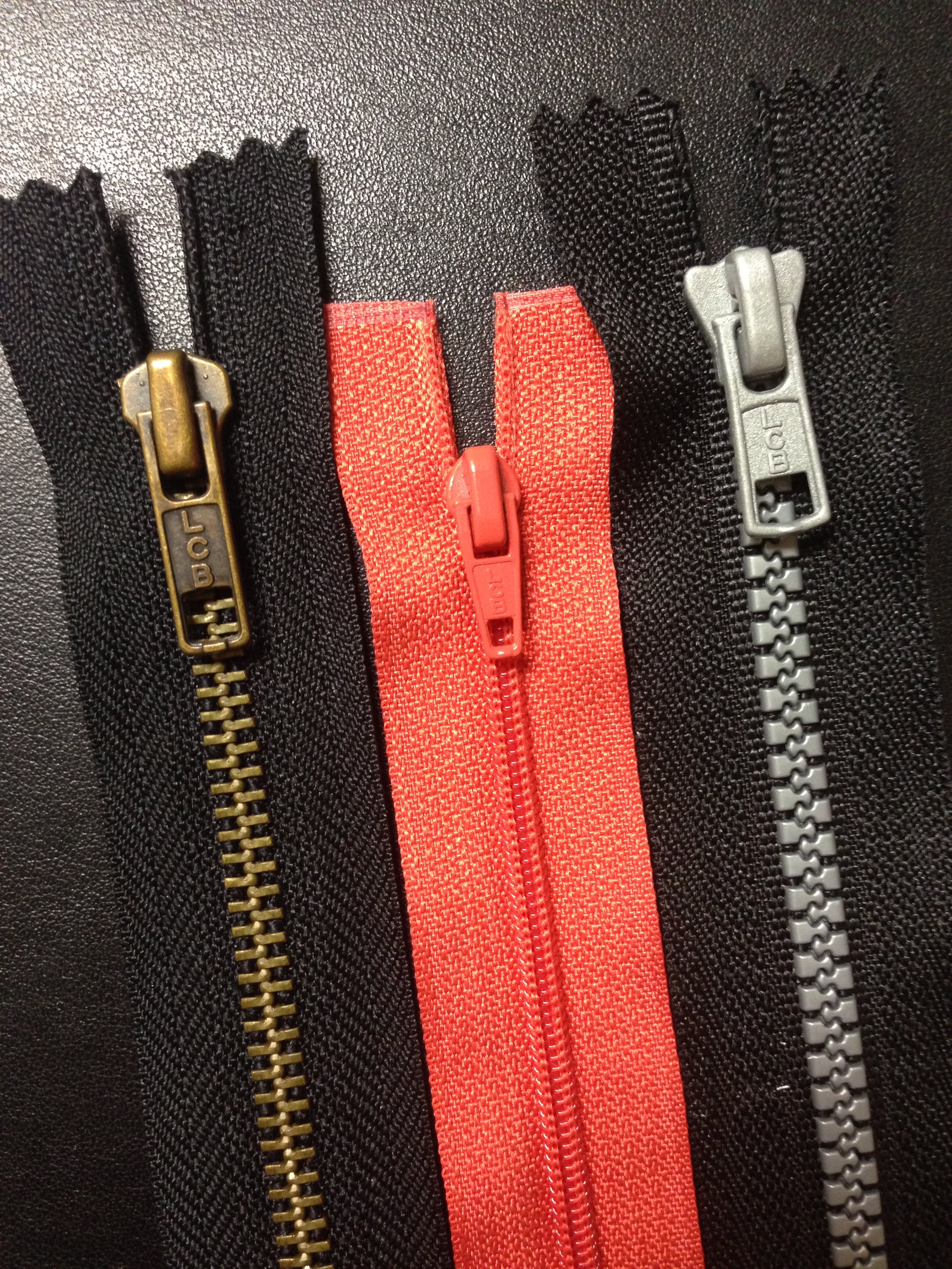 A graphic of a zipper partially unzipped.