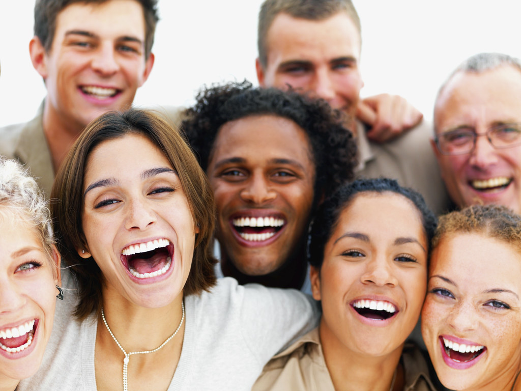 A group of people laughing together.