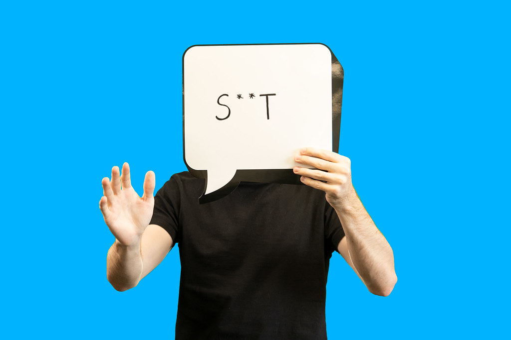 A person holding a thought bubble with the word information inside.