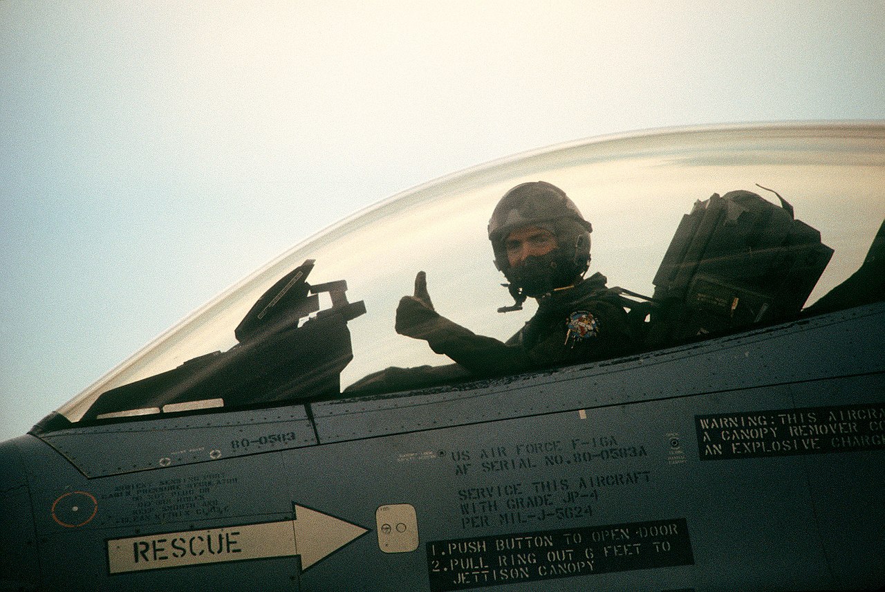 A pilot giving a thumbs up signal