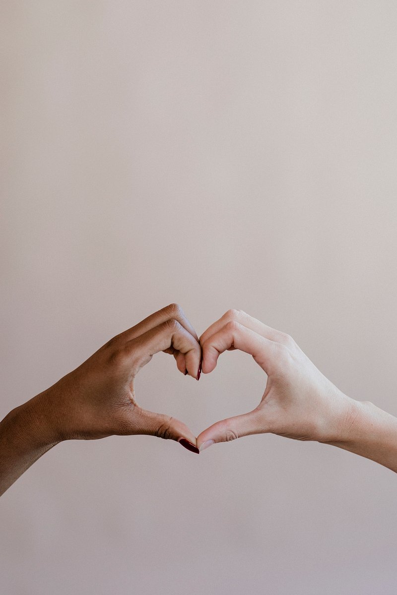 A simple image of hands in a heart shape.