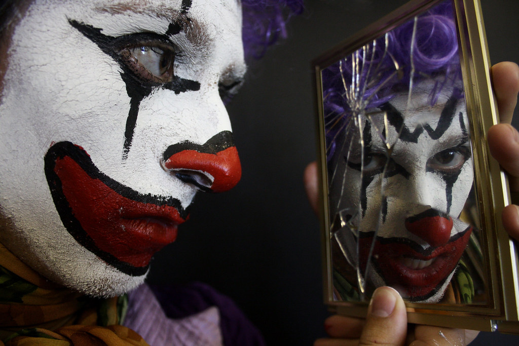 Clown reflection in a mirror