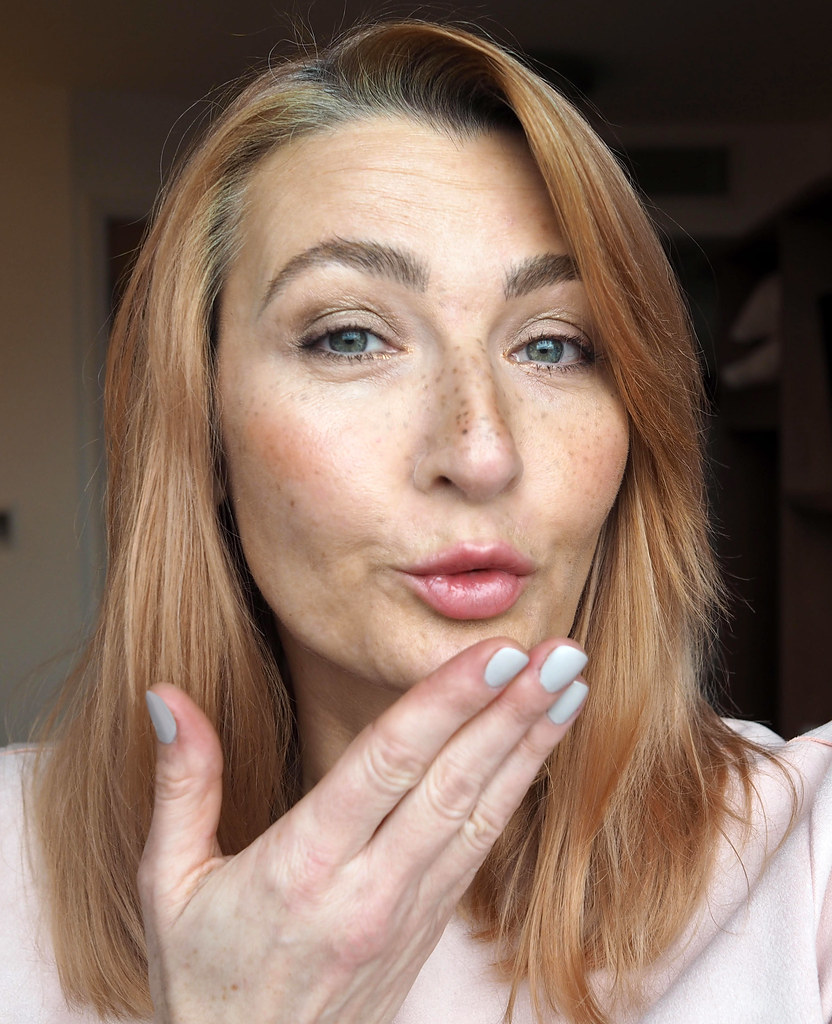 Confident woman blowing a kiss