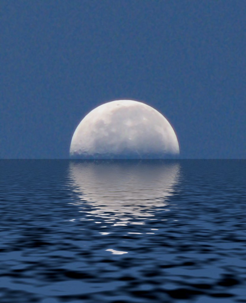 Moon reflecting on a calm body of water
