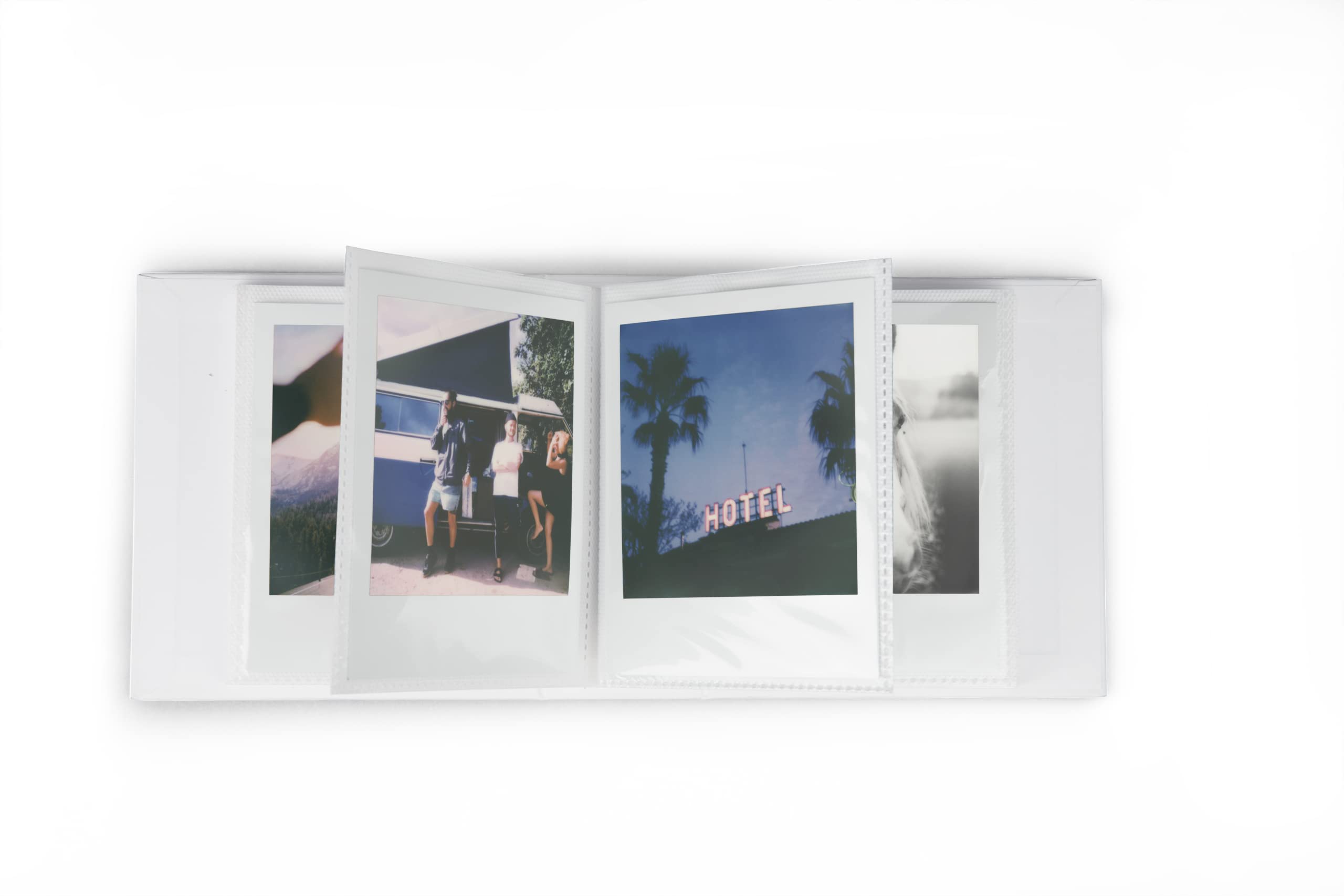 Photo album with pictures and Polaroid snapshots