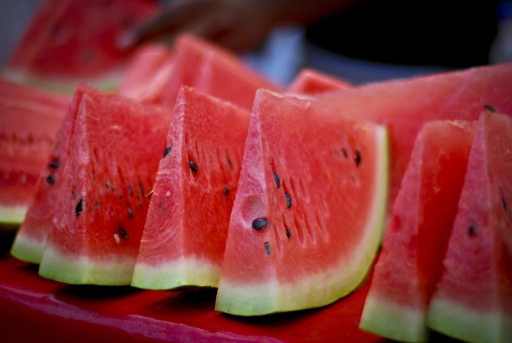 Watermelon being used as a canteen.
